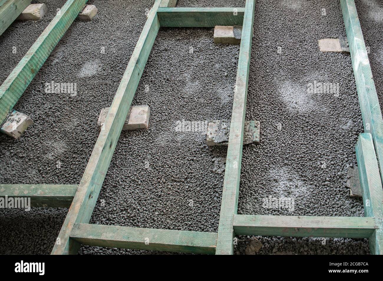 Floor base construction. Wooden details, leveling and precision. Cement
