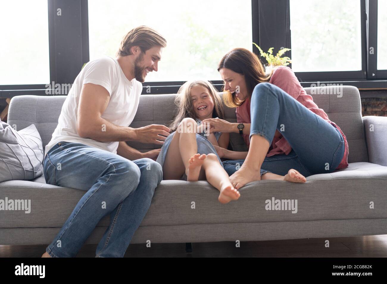 Portrait of family having fun in the living room Stock Photo