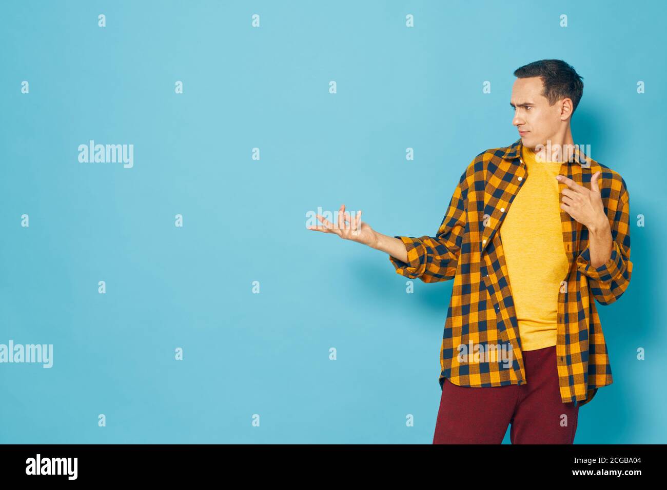 The shirt guy shows his hand to the side Stock Photo - Alamy