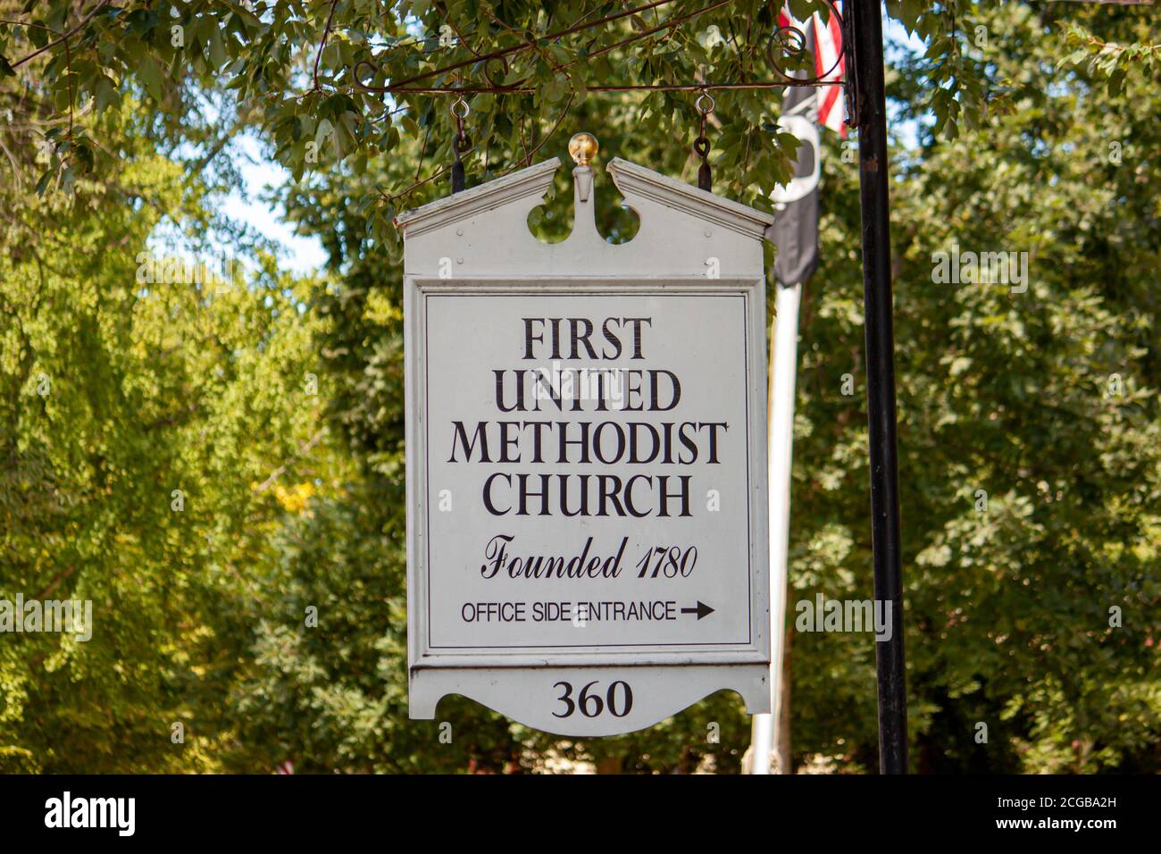 Chestertown, MD 08/30/2020: A wooden board street sign showing the direction of the First United Methodist Church (a historic landmark built on 1782) Stock Photo