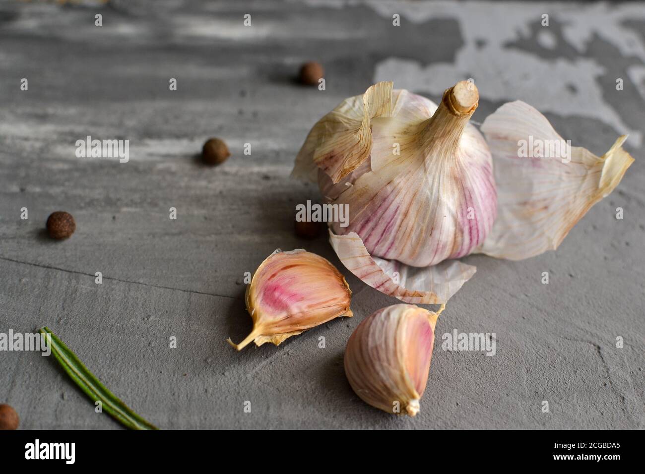 Garlic on a gray background. Healthy food. Free space for text. Stock Photo