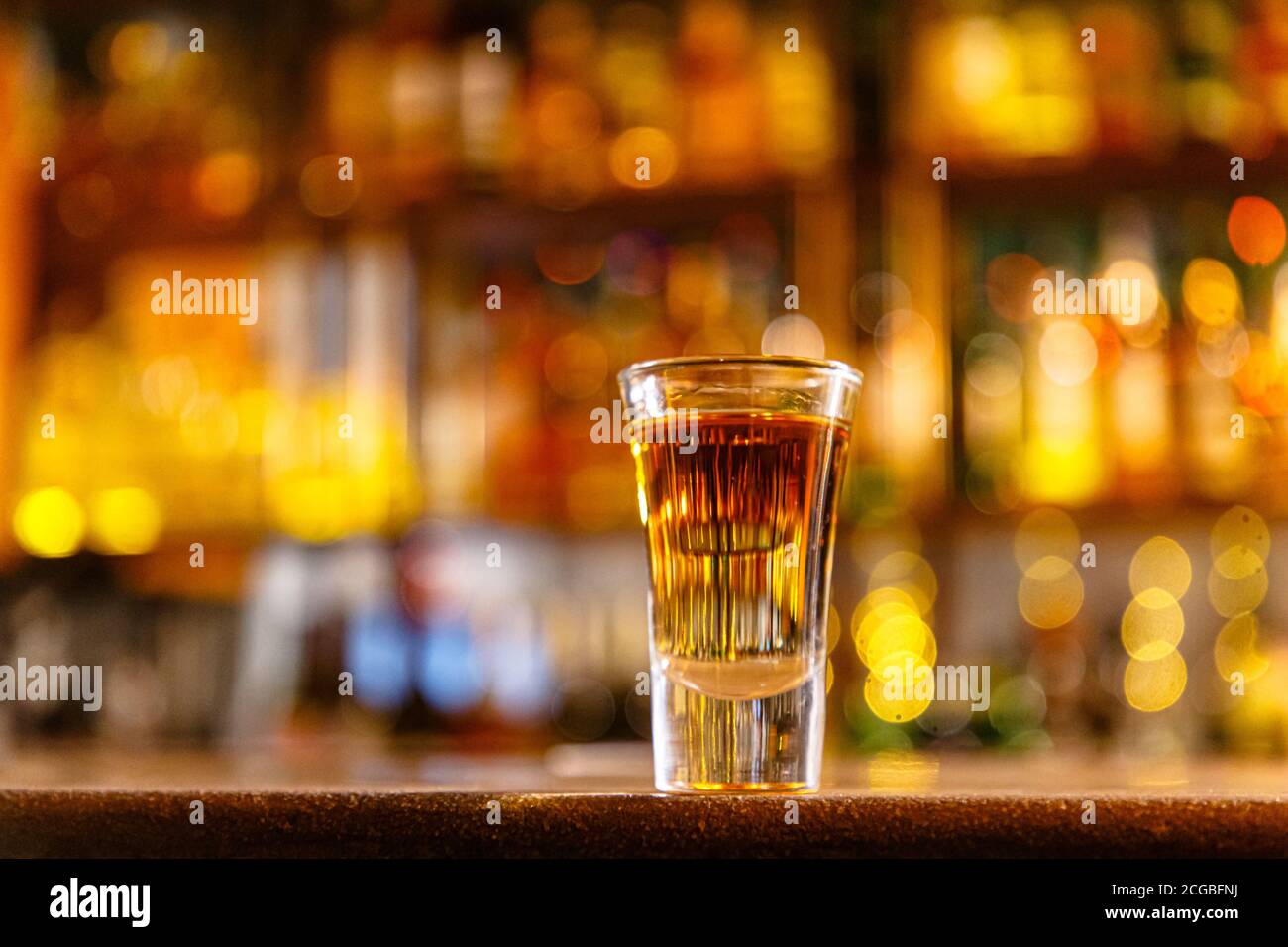 Toast with cognac or brandy with vodka or liqueur is on the bar. Stock Photo