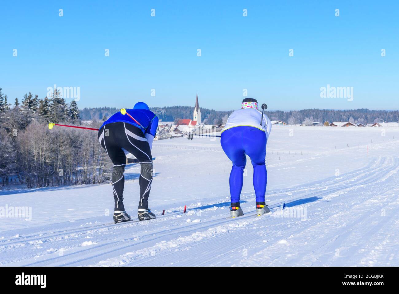 Sporty cross-country skiers on the way in beautiful wintry landsacpe Stock Photo