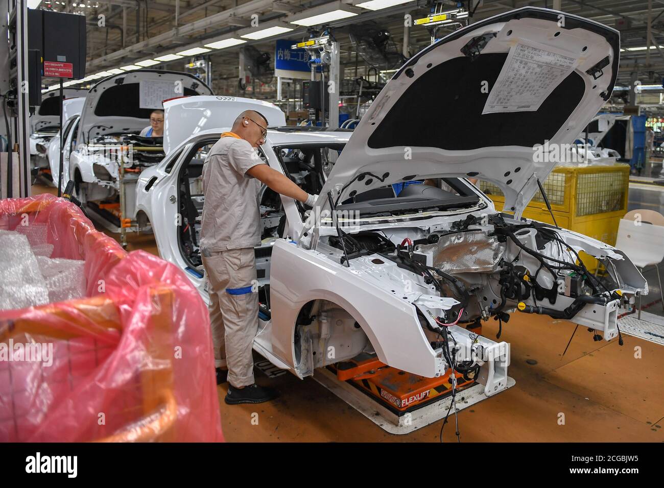 Changchun, China's Jilin Province. 1st Sep, 2020. Employees work at an assembly workshop of FAW-Volkswagen Automobile Co., Ltd. in Changchun, capital of northeast China's Jilin Province, Sept. 1, 2020. First Automotive Works (FAW) Group Co., Ltd., China's leading automaker, sold 314,454 vehicles in August, up 14 percent year on year, according to corporate sources. Credit: Zhang Nan/Xinhua/Alamy Live News Stock Photo