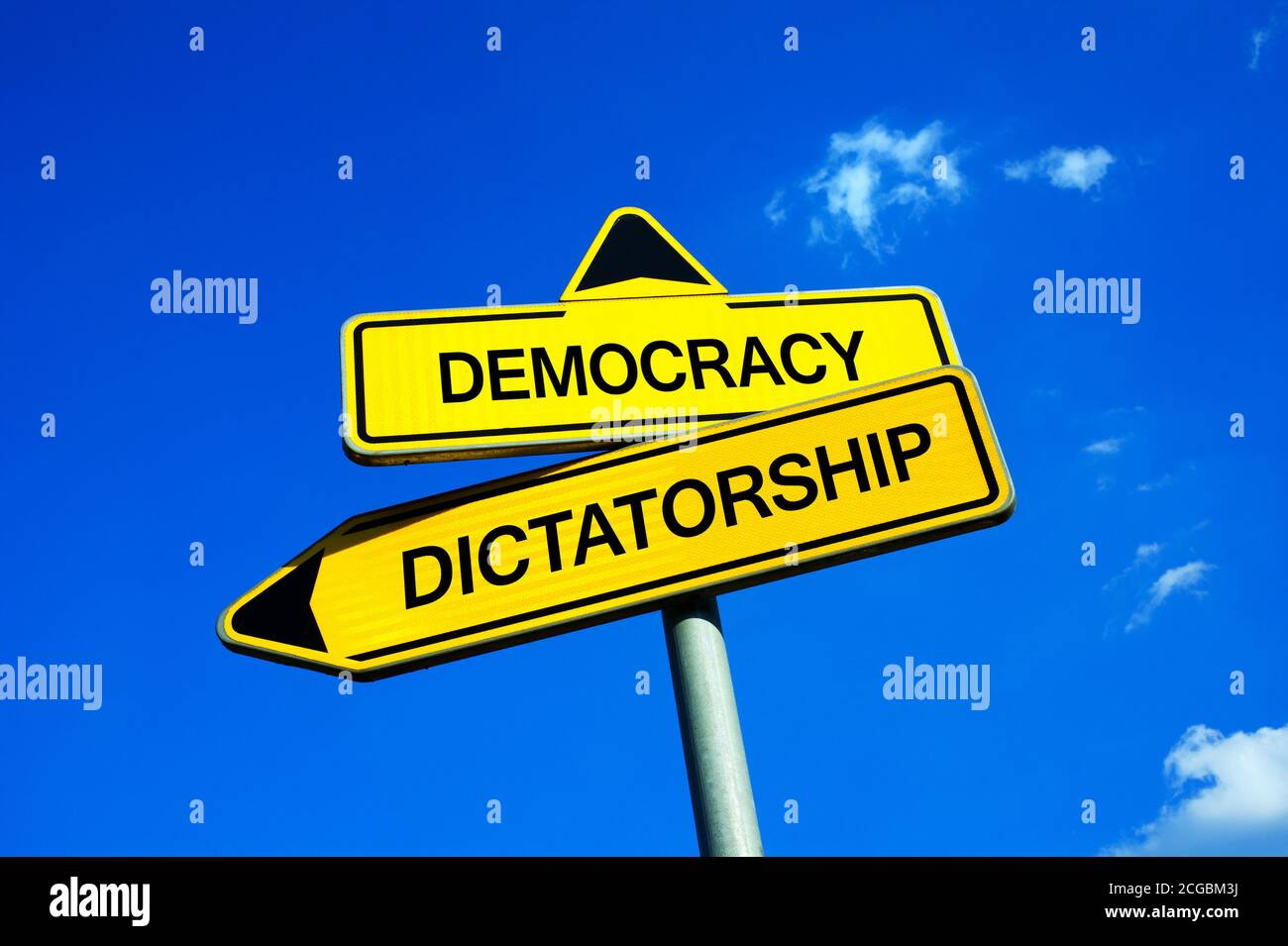 Democracy vs Dictatorship - Traffic sign with two options - democratic election or dictatorship of strong authoritarian ruler with power and dominance Stock Photo