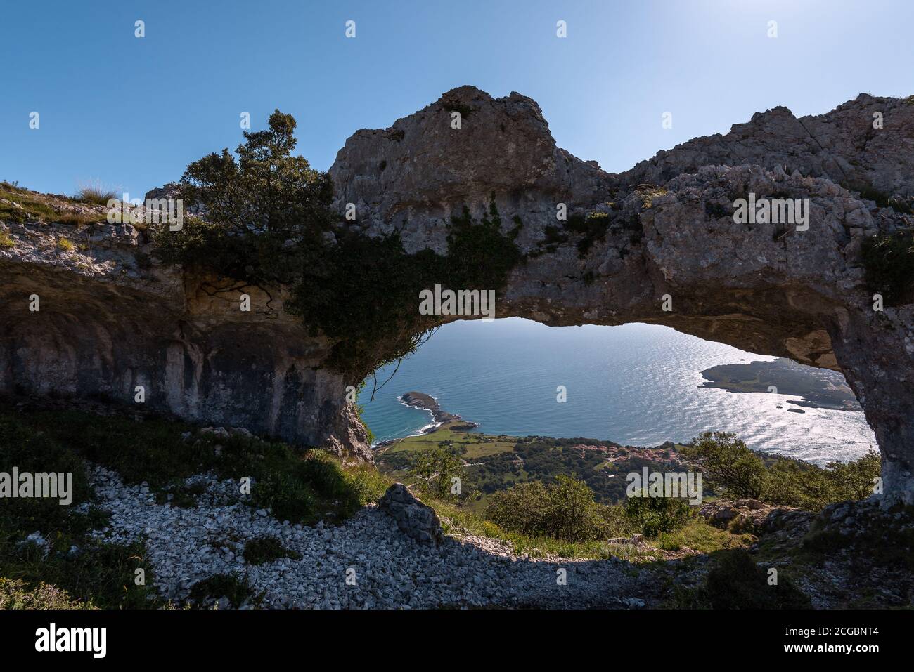 Natural arch called Ojo del Diablo (Eye of the Devil) in Cantabria, Spain Stock Photo