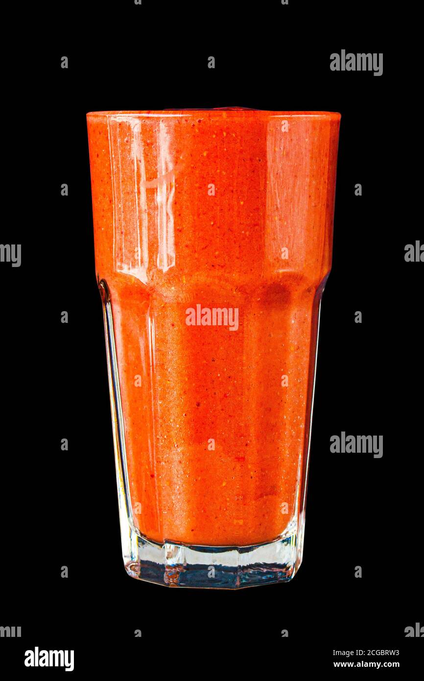 Red berry smoothie in a large glass glass on a black background, isolated Stock Photo