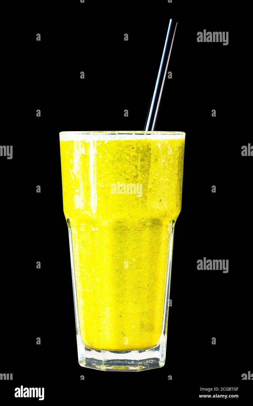 Orange citrus smoothie in a large glass glass on a black background, isolated. Stock Photo