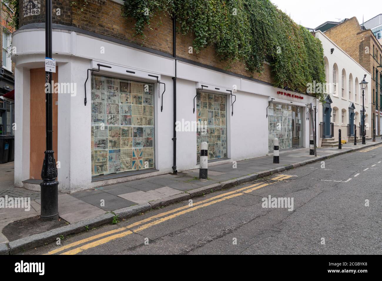 The temporarily closed Ottolenghi restaurant in Artillery Lane, Spitalfields with newspapers blocking the windows. Stock Photo