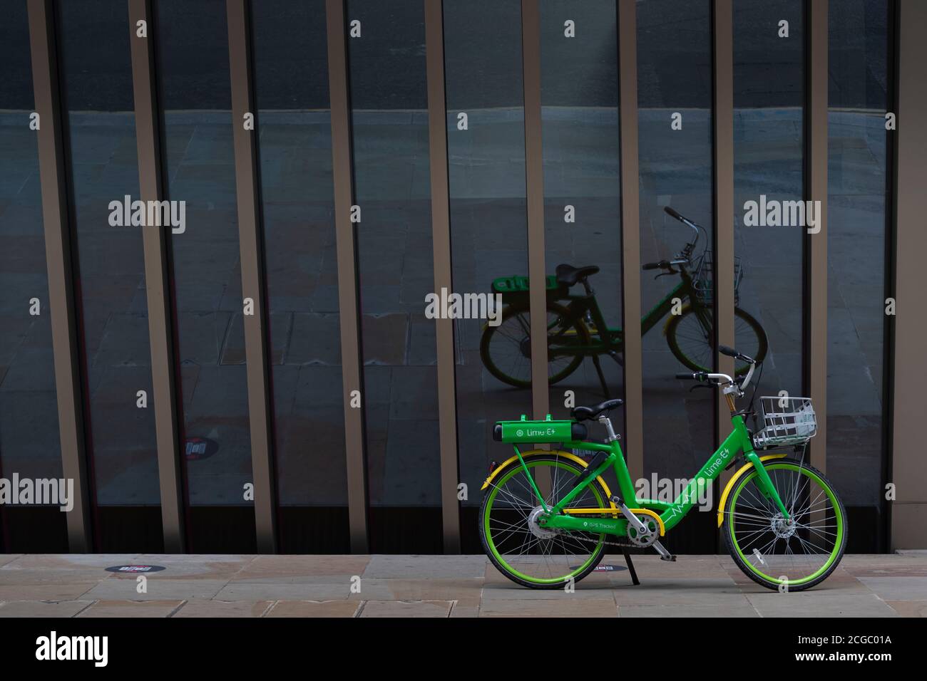 Green hire bike outside a London office Stock Photo Alamy