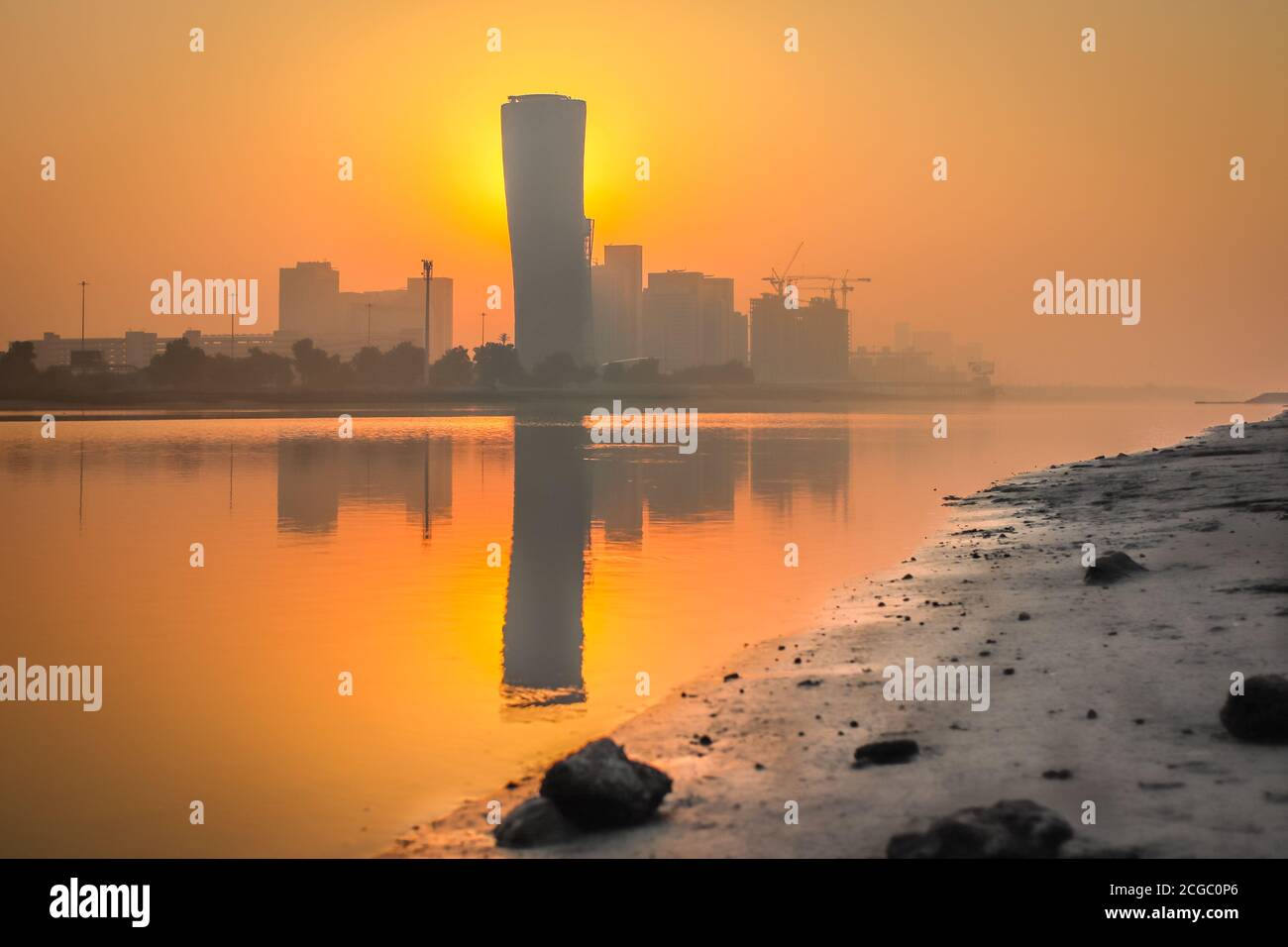 Sunrise Sky view background behind capital gate tower of Abu Dhabi, Skyscrapers in Capital city of United Arab Emirates Stock Photo