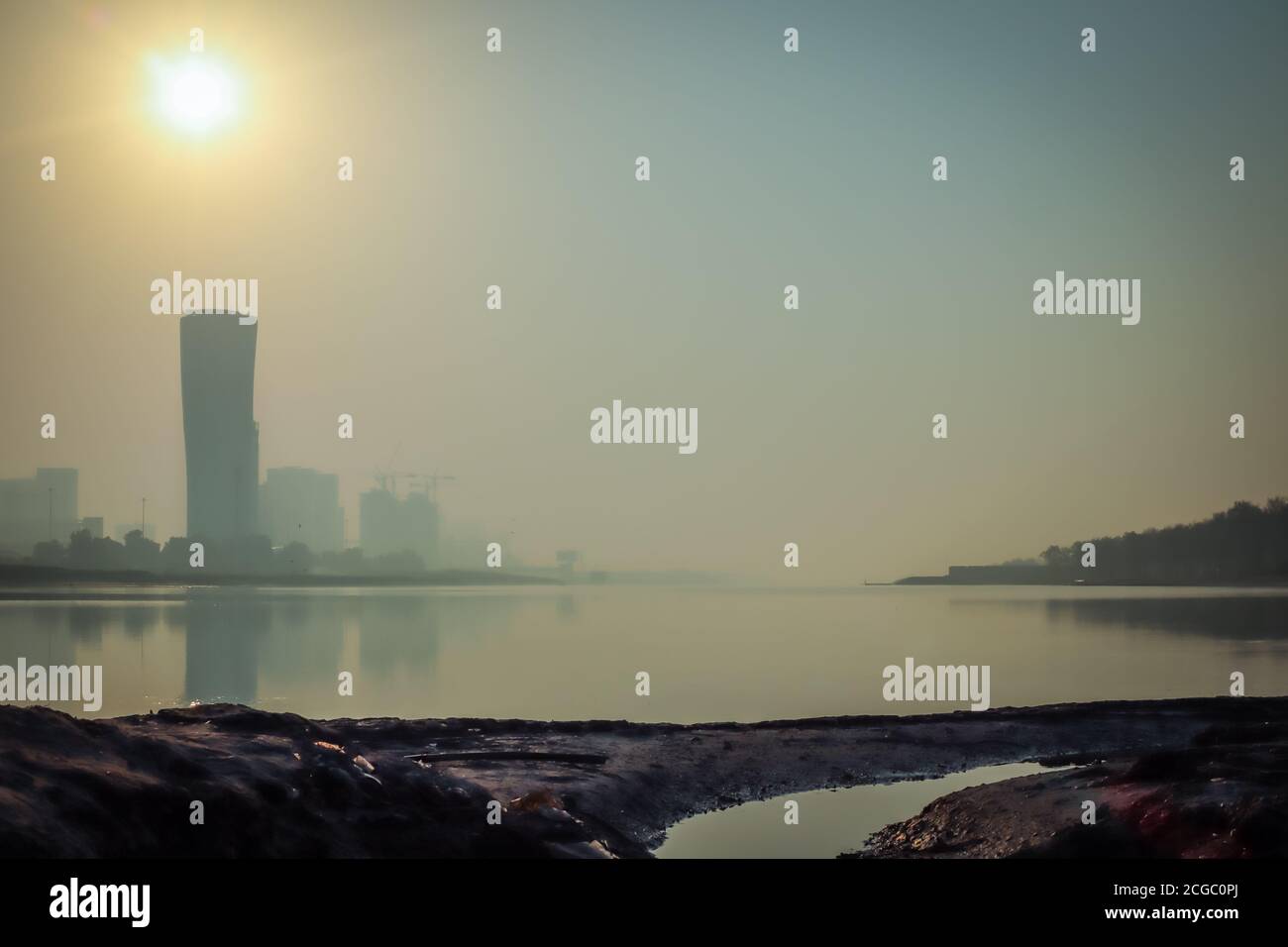 Sunrise Sky view background behind capital gate tower of Abu Dhabi, Skyscrapers in Capital city of United Arab Emirates Stock Photo