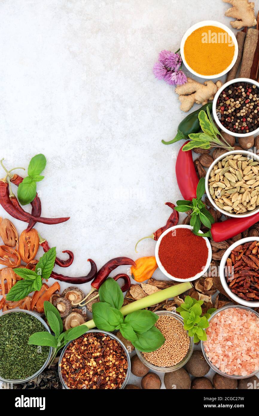 Herb and spice border with fresh and dried herbs and spices on light ...
