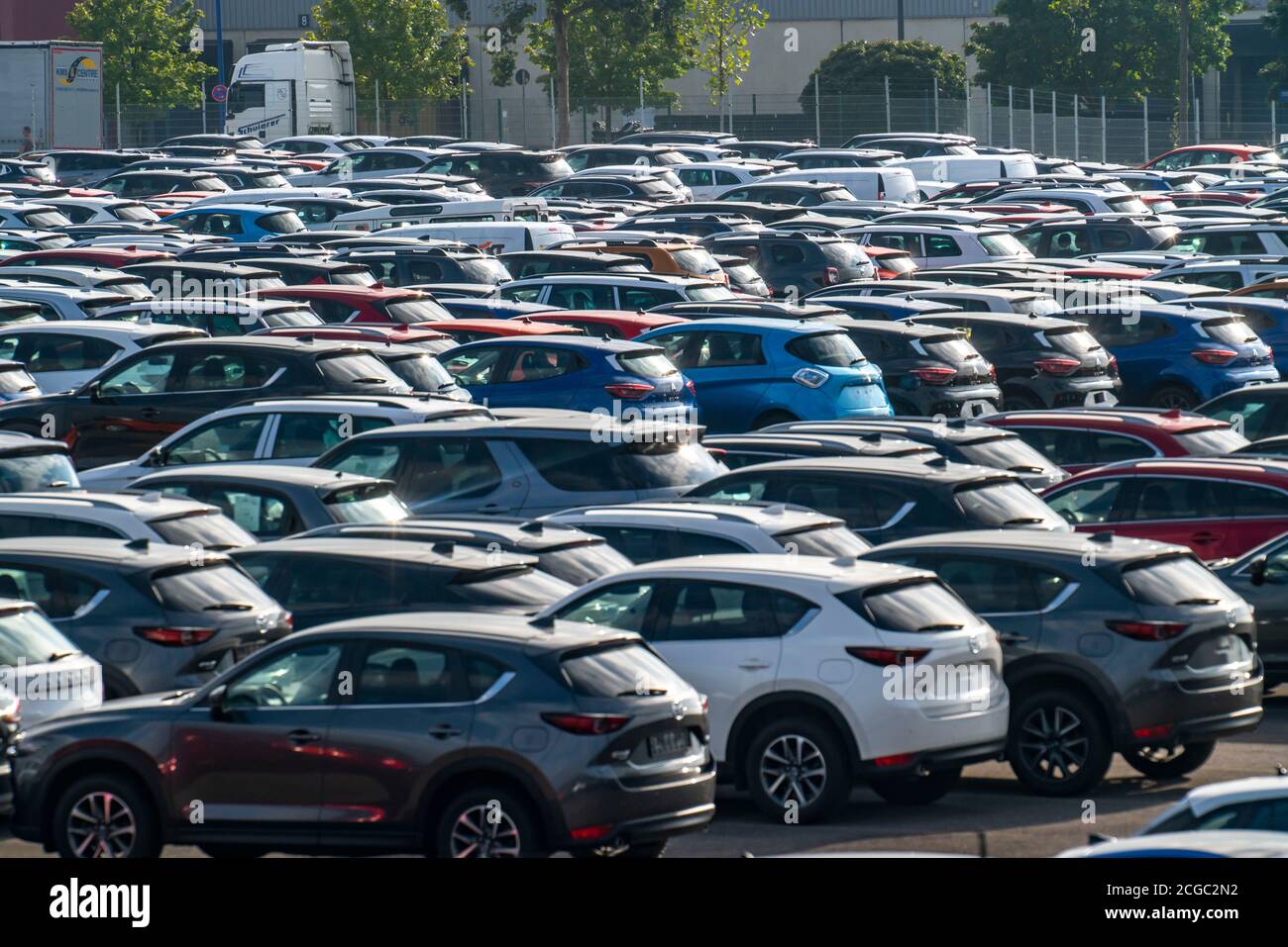Car terminal in the inland port Logport I, in Duisburg at river Rhein, vehicle handling of new cars, storage area,  NRW, Germany Stock Photo
