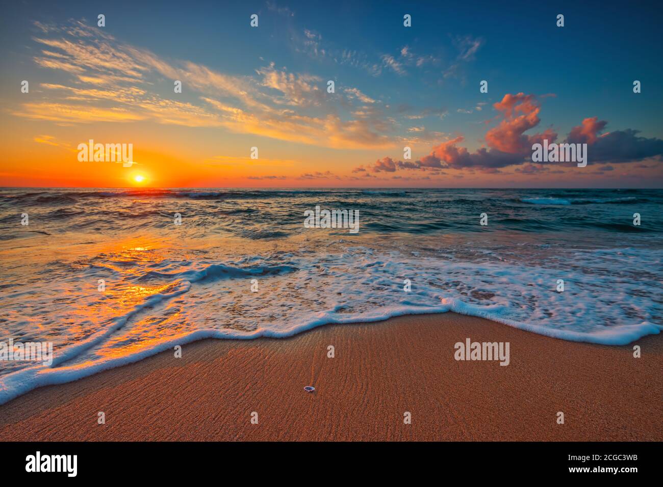 Beautiful cloudscape over the sea, sunrise shot Stock Photo - Alamy