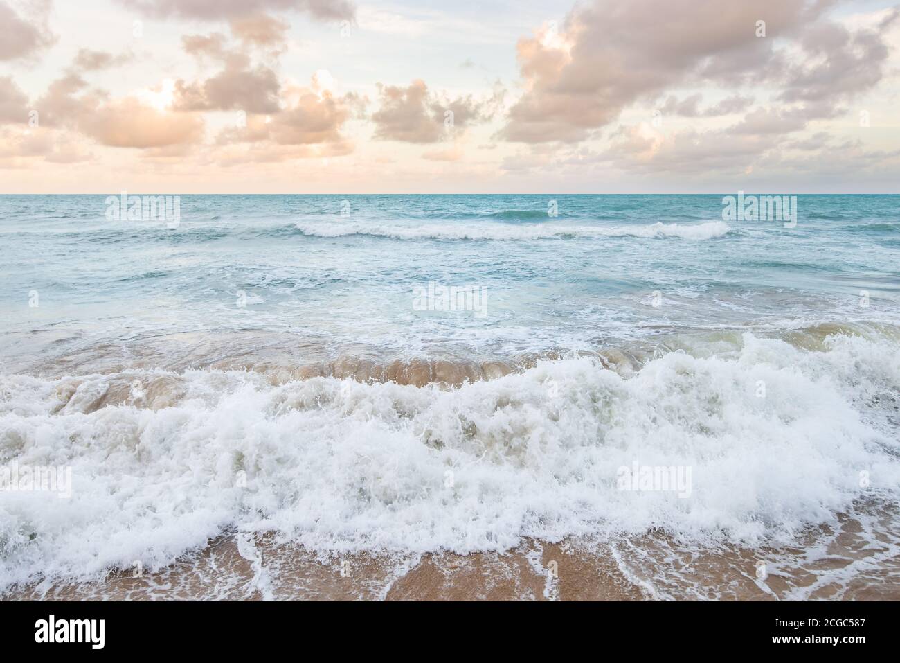 Beautiful waves on sandy beach hi-res stock photography and images - Alamy