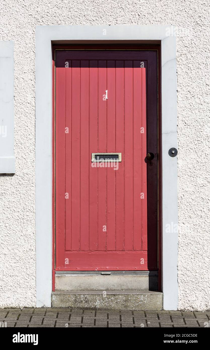 Red timber front door. Stock Photo