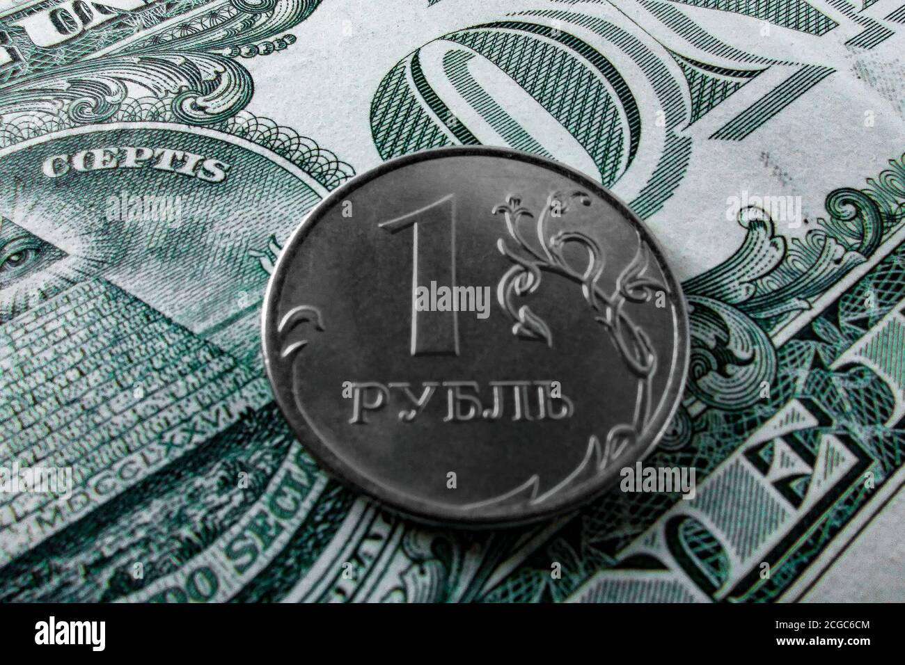 One ruble coin on a paper dollar. National currency devaluation Stock Photo
