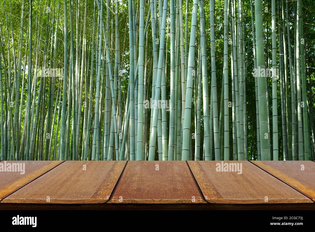 Bamboo forest background with wood table photo montage for product display. Background of Arashiyama The famous bamboo forest in Kyoto, Japan. Stock Photo