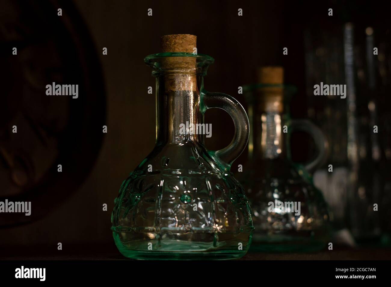 Glass vessels under olive oil. Stock Photo