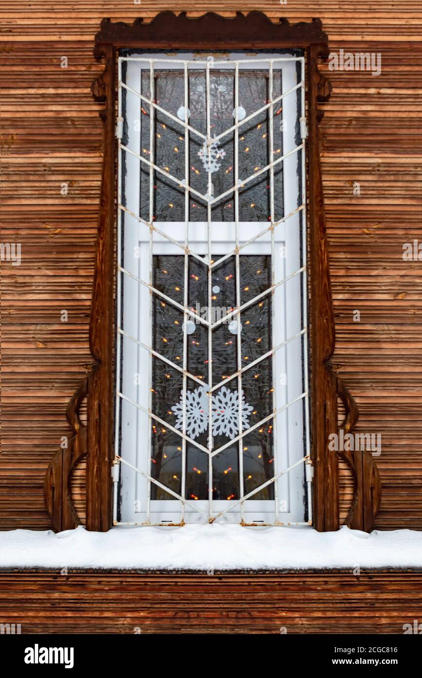 A barred window in an old wooden house. Winter Stock Photo Alamy