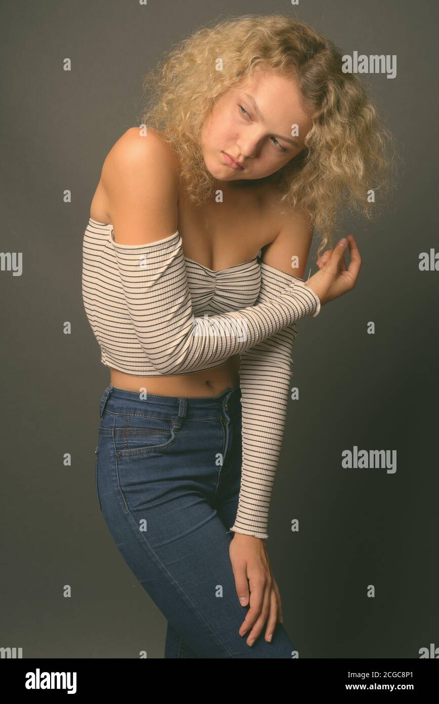 Beautiful young blond curly woman hi-res stock photography and images ...