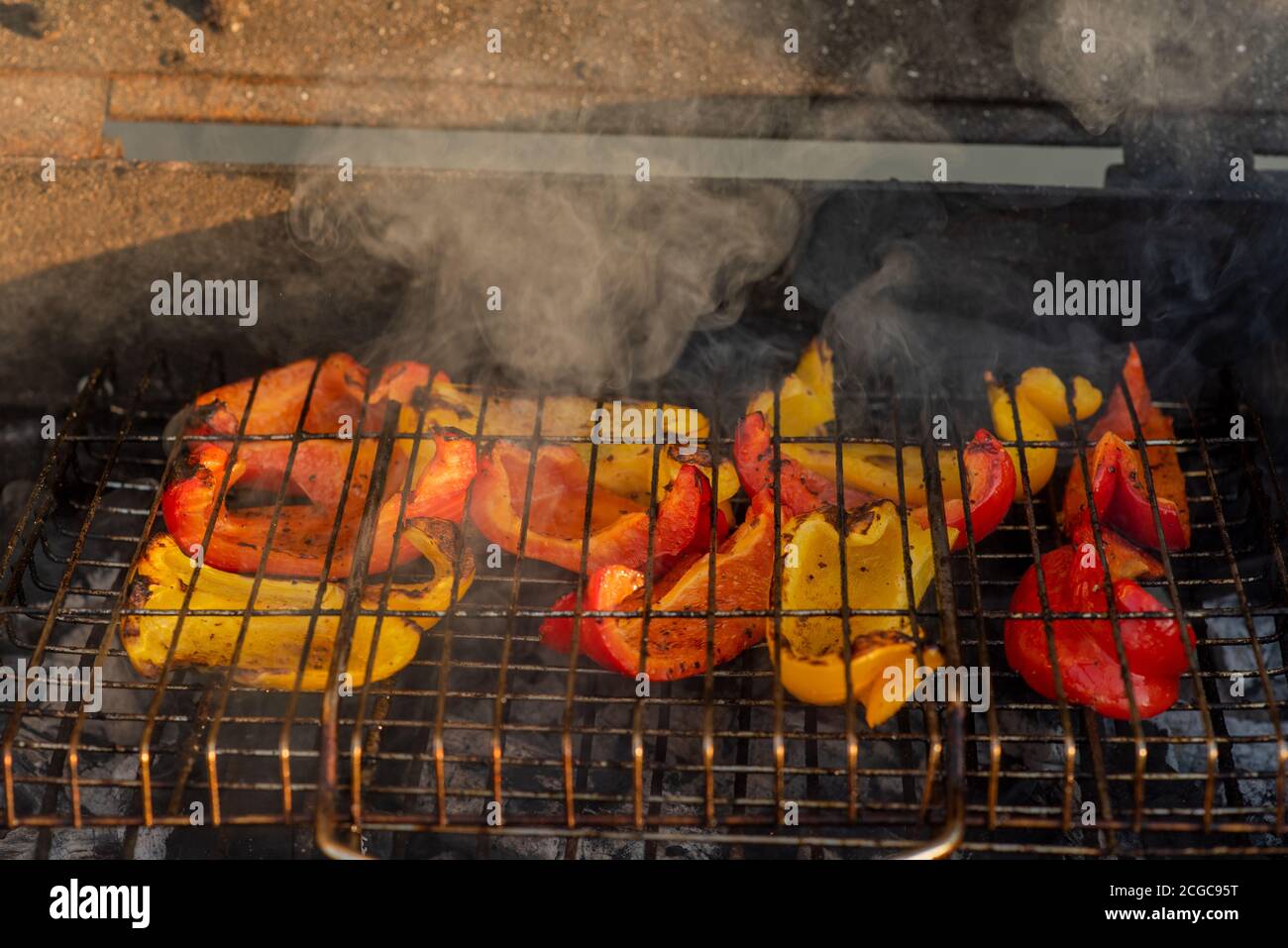 Bulgarian pepper is fried over a fire. Healthy diet. The vegetables are ...