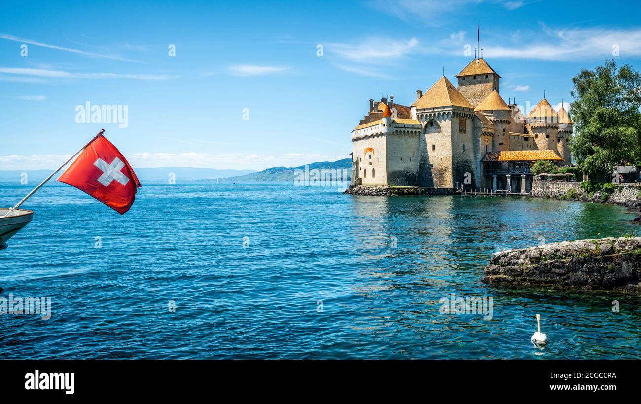 Chillon castle view with Swiss flag and Lake Geneva view in Vaud Switzerland Stock Photo