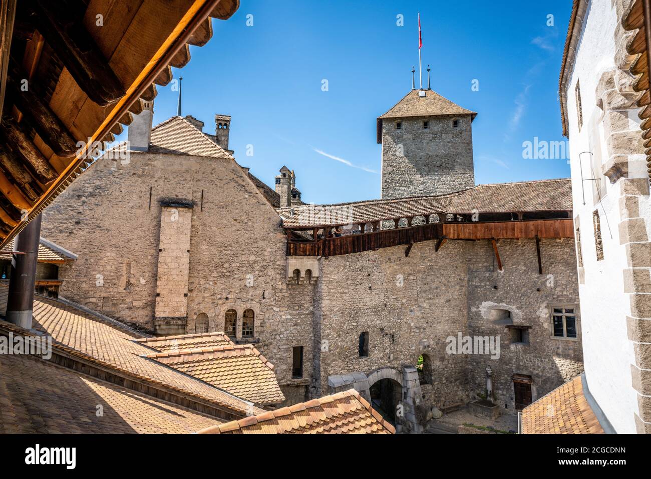 Chillon castle interior courtyard wide angle view with tower taken from wall walk in Vaud Switzerland Stock Photo