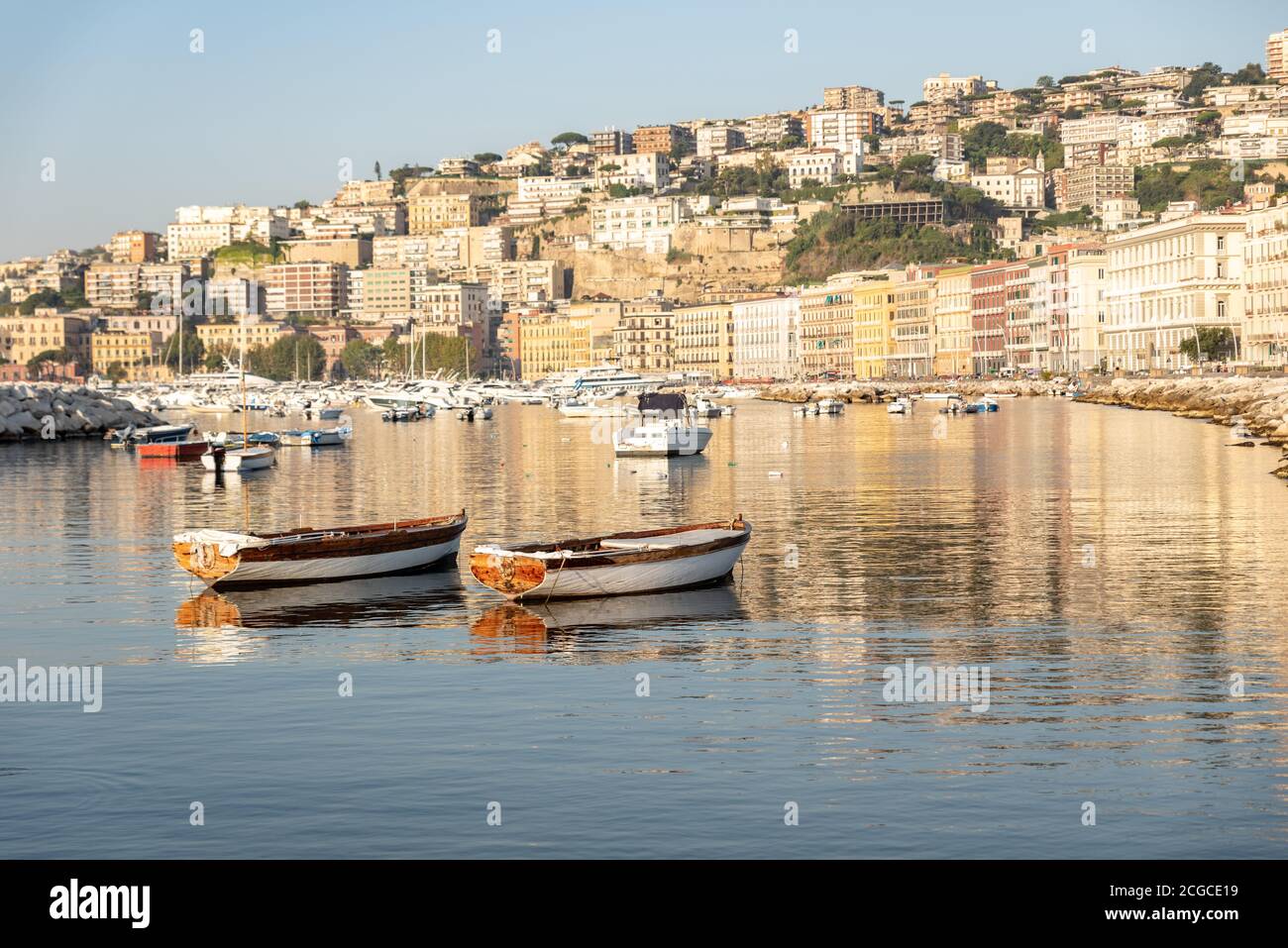 Couple of small wood boat in mergellina, beautiful sunrise, Naples, Italy Stock Photo