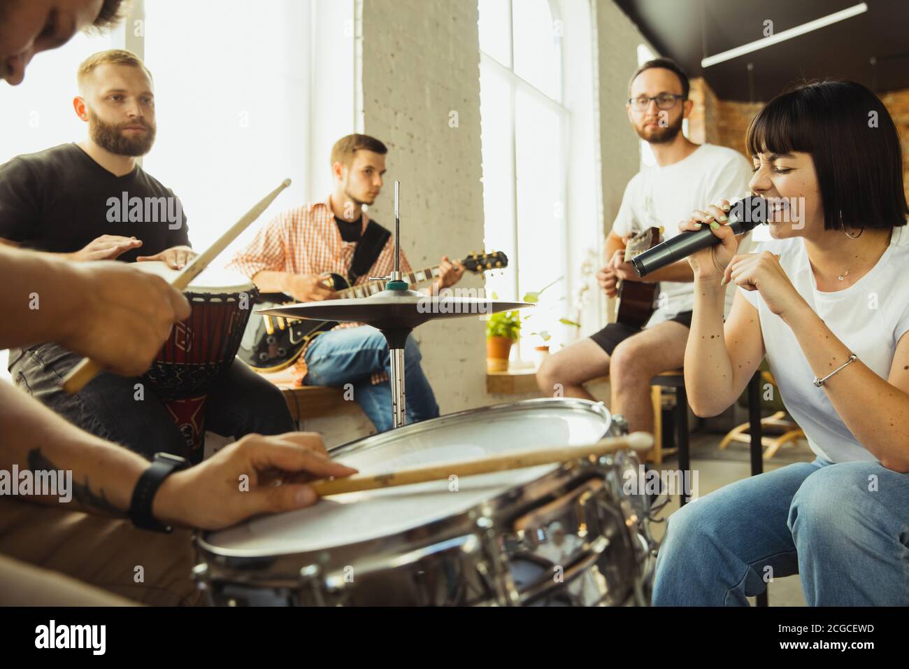Festival. Musician band jamming together in art workplace with