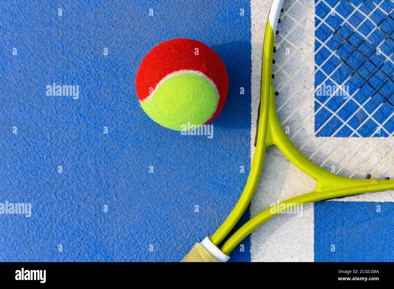 tennis ball and racket in an outdoor court Stock Photo Alamy