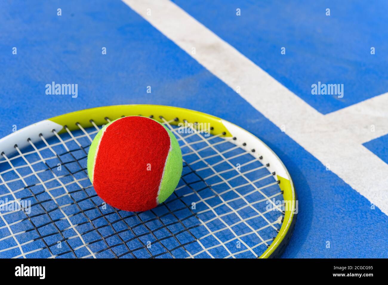 tennis ball and racket in an outdoor court Stock Photo - Alamy