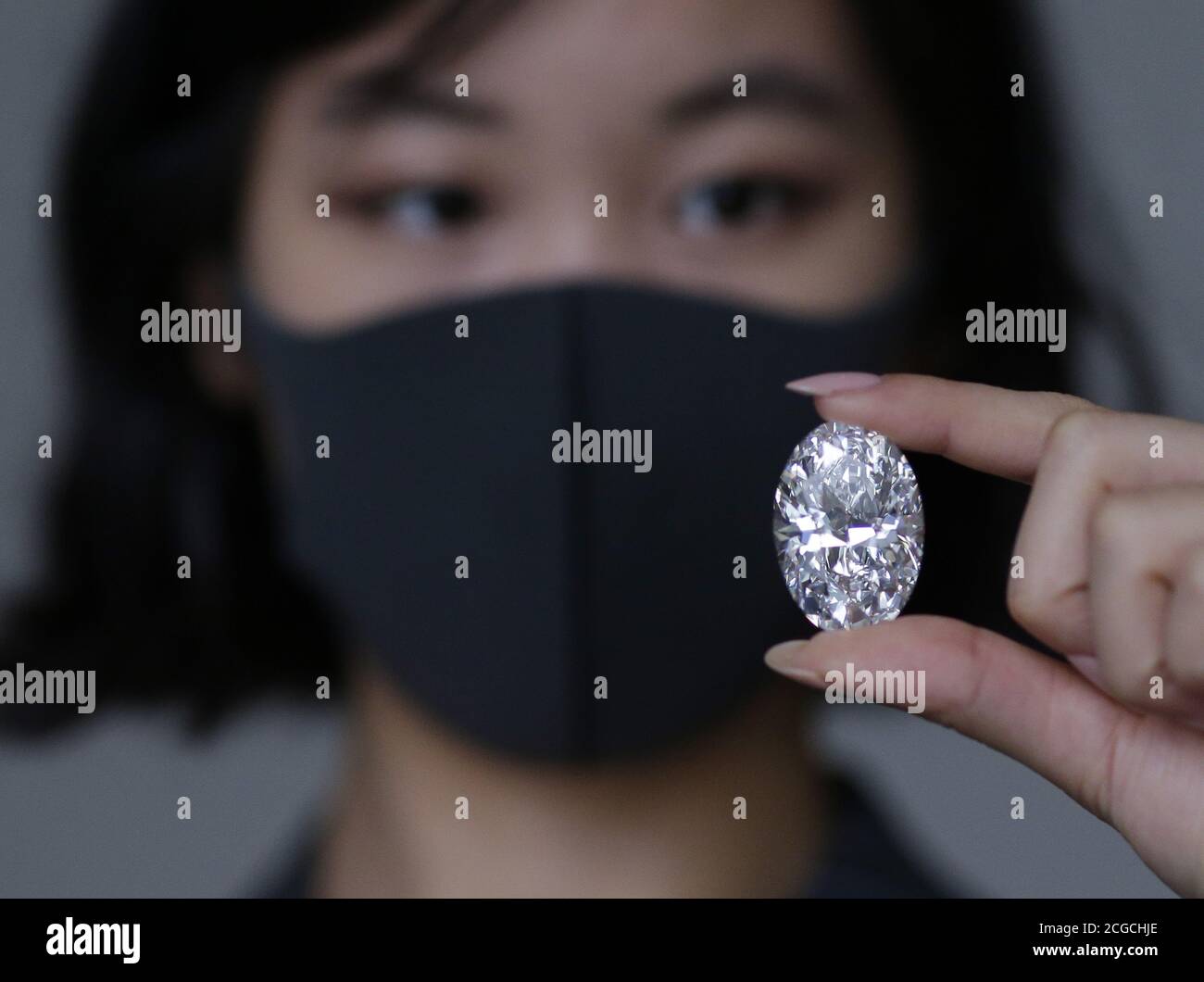 New York, United States. 10th Sep, 2020. Joanna Gong holds a 'Perfect' 100  Carat Diamond that Sotheby's unveils on Wednesday, September 9, 2020 in New York City. Only seven other D colour Internally Flawless or Flawless white diamonds over 100 carats have been sold at auction, making this the eighth. Photo by John Angelillo/UPI Credit: UPI/Alamy Live News Stock Photo