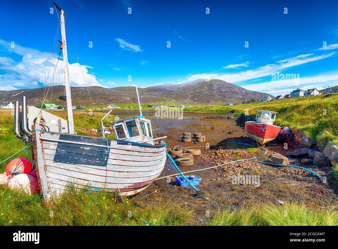 Old fishing boats at Leverburgh on the Isle of Harris in the Western Isles of Scotland Stock Photo