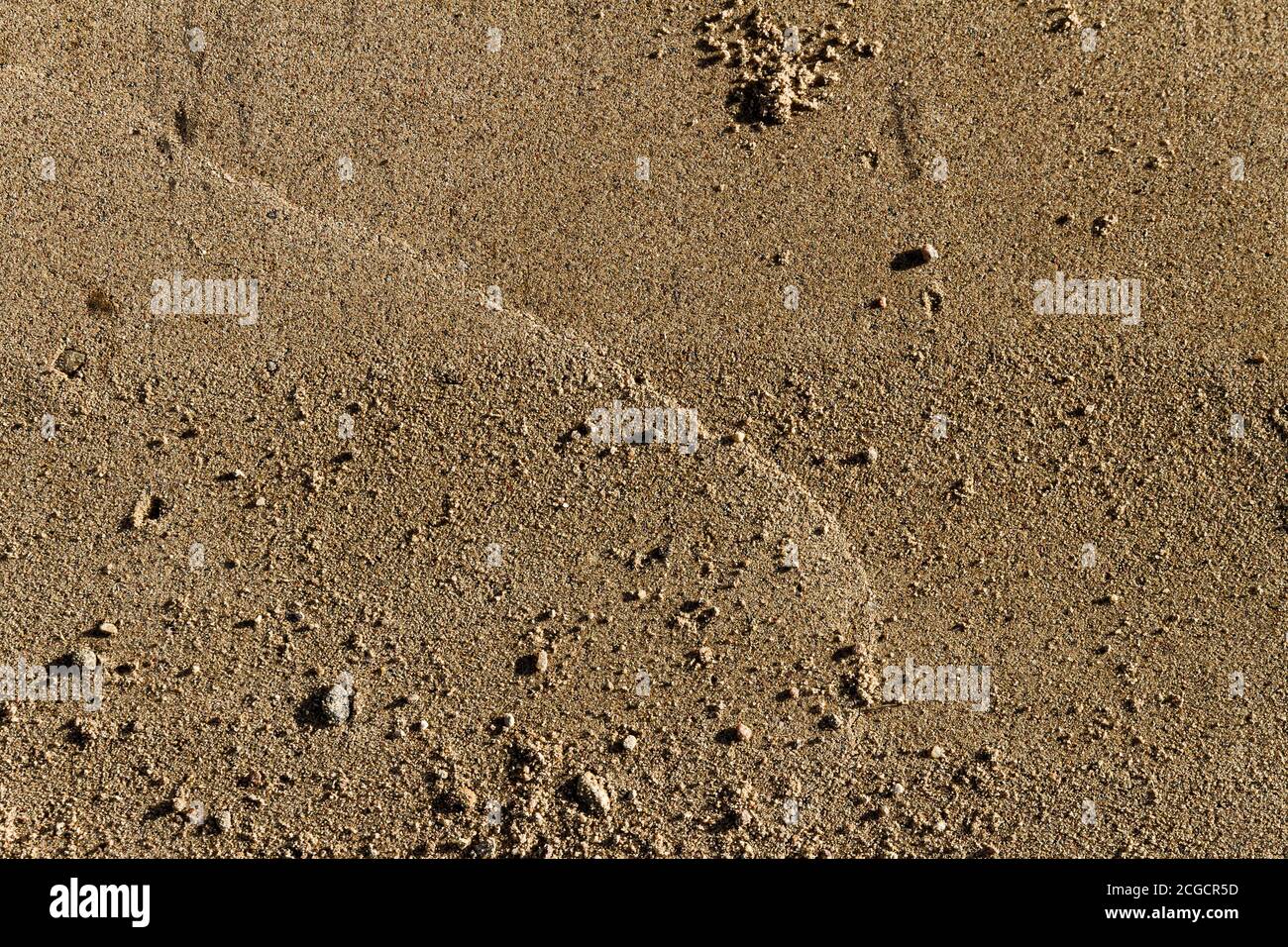 Background of flat sand fine gravel Stock Photo