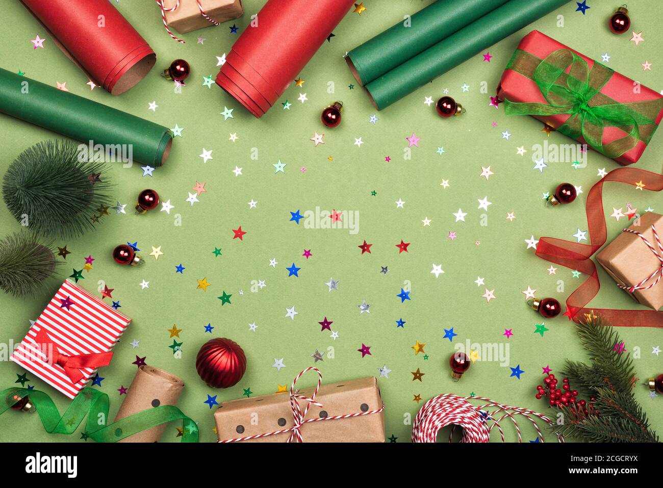 Green background with gift boxes, paper rolls Stock Photo Alamy