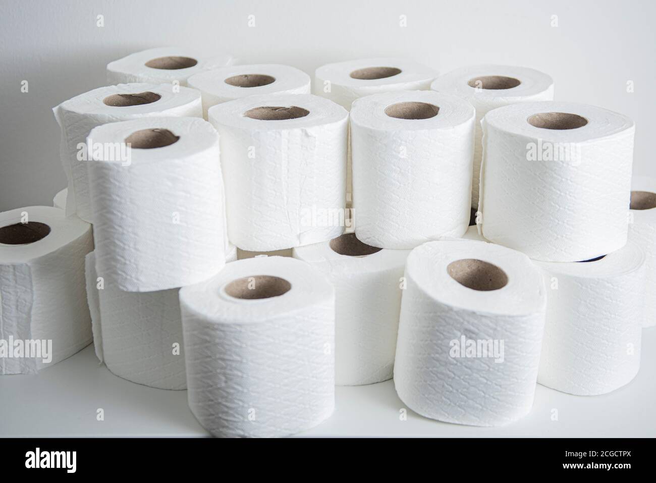 Stacked rolls of toilet paper Stock Photo - Alamy
