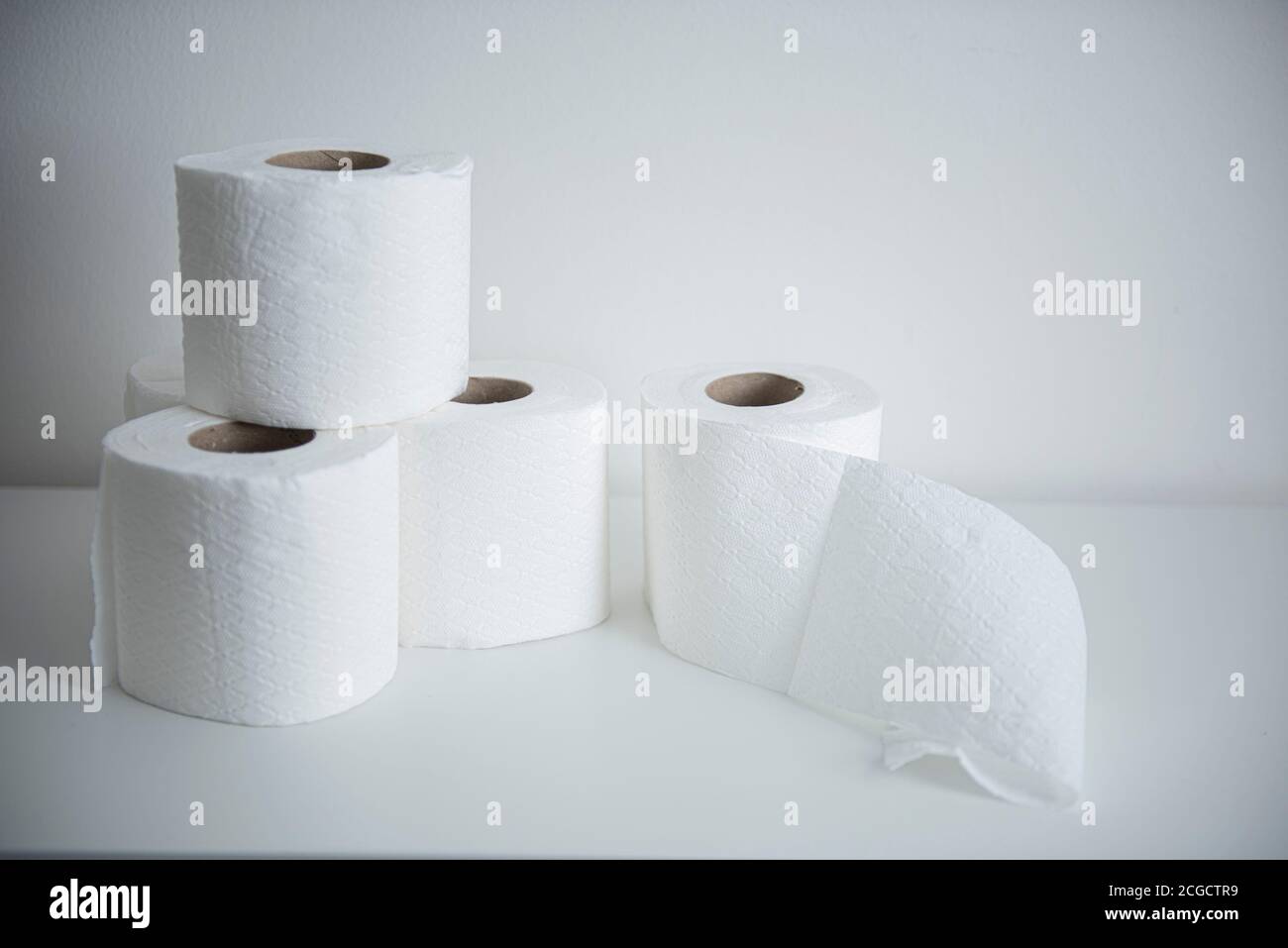 Stacked rolls of toilet paper Stock Photo - Alamy