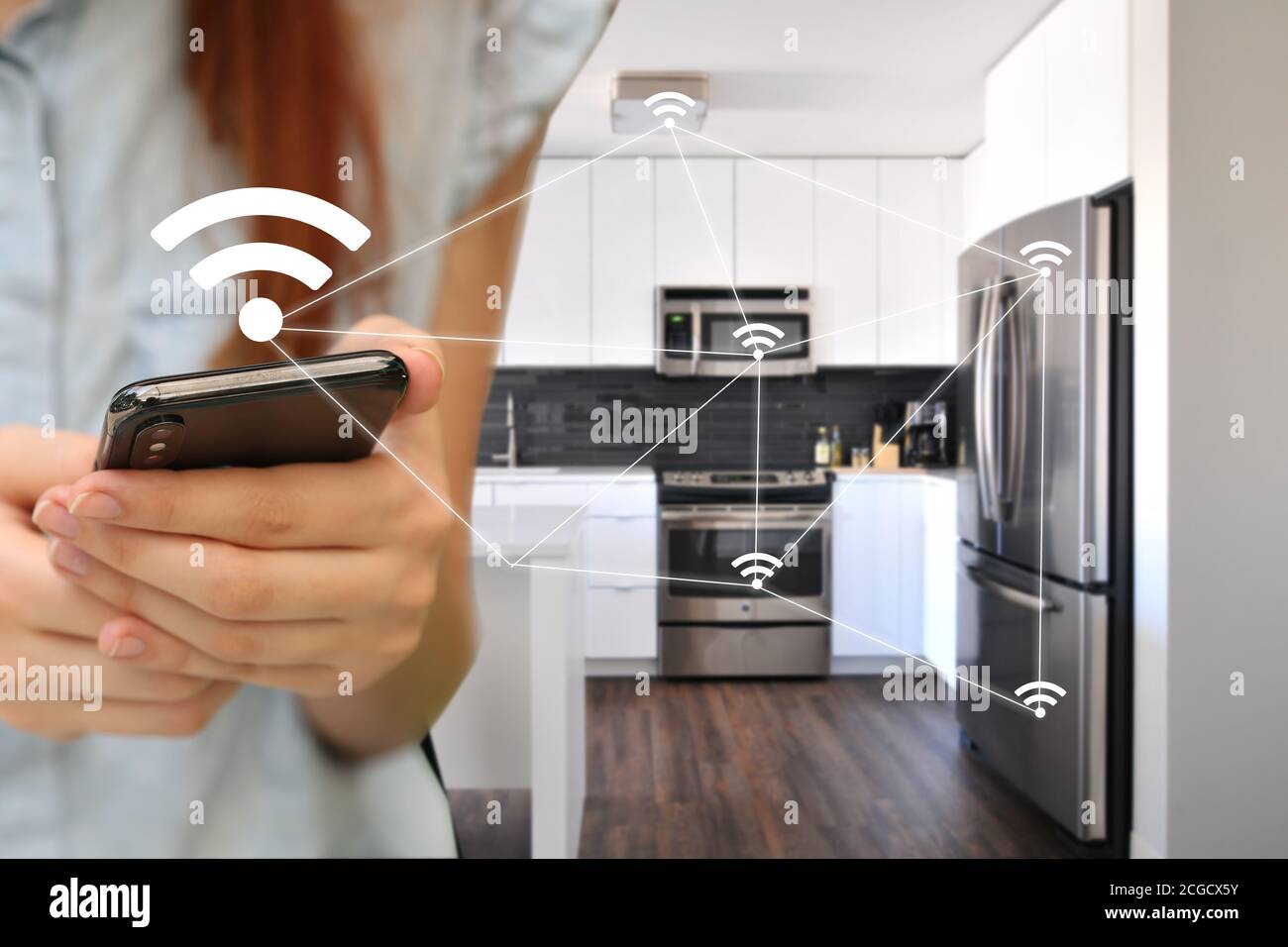 Home automation. of things. A woman controls the kitchen