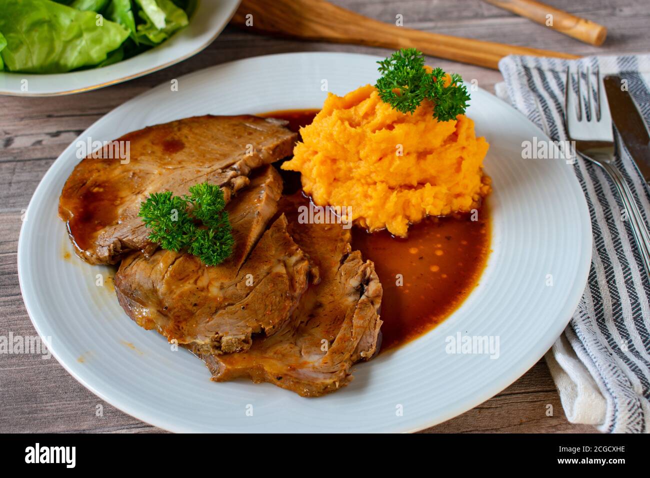 Roast pork with mashed potatoes and gravy Stock Photo