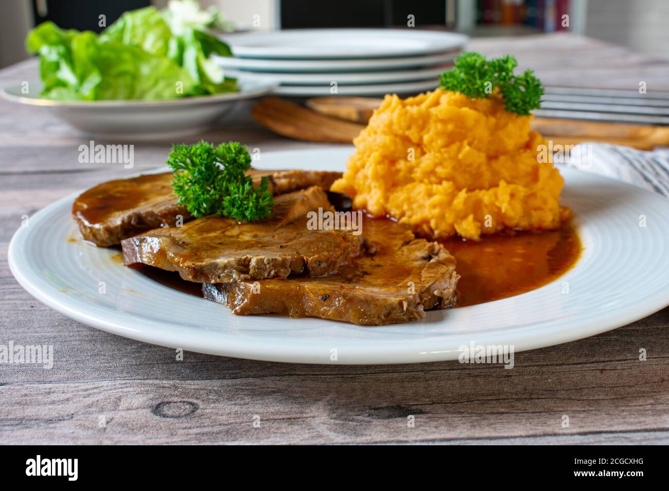Roast pork with mashed potatoes and gravy Stock Photo