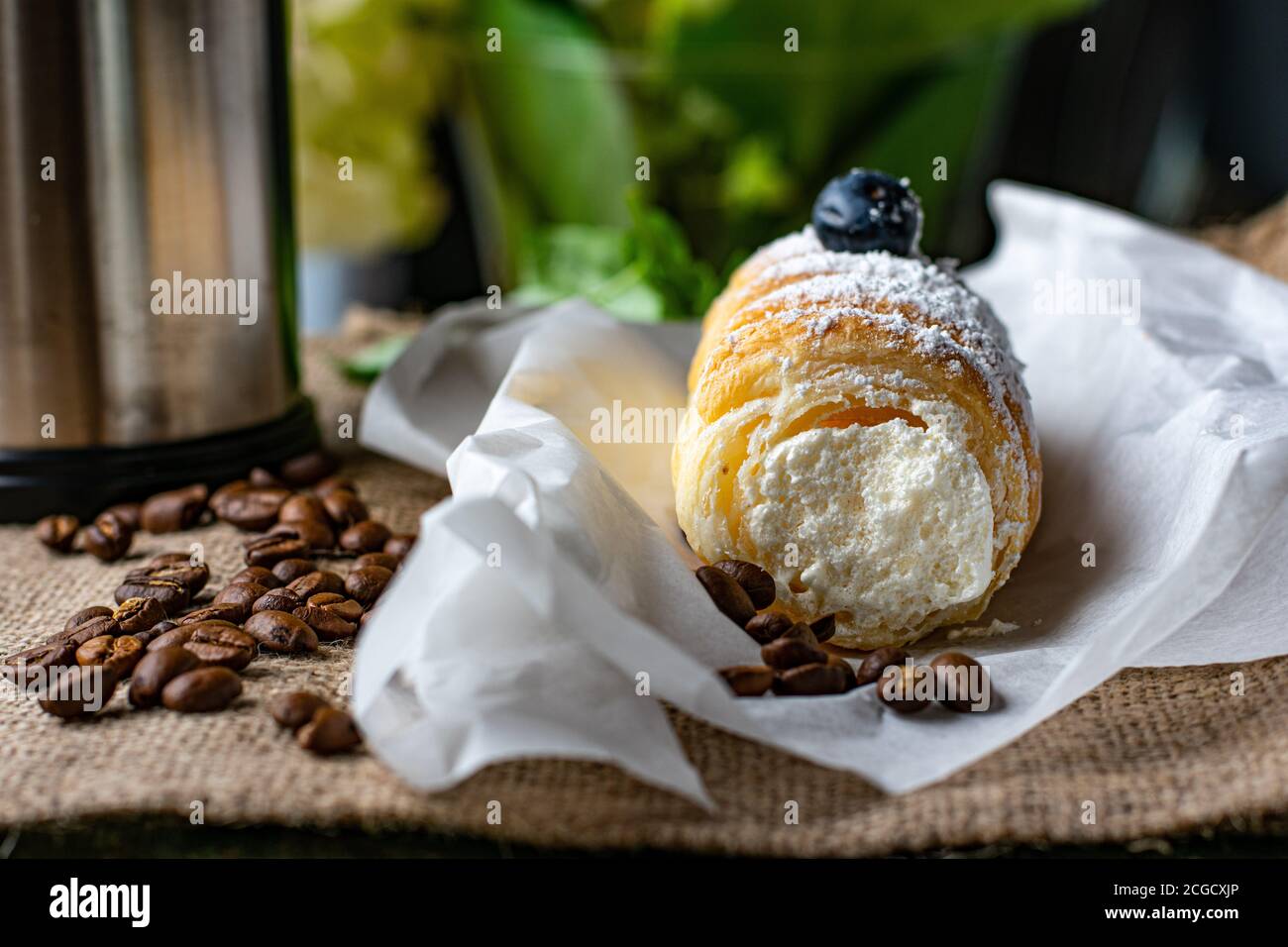 fresh bakery puff pastry roll with whipped cream filling Stock Photo