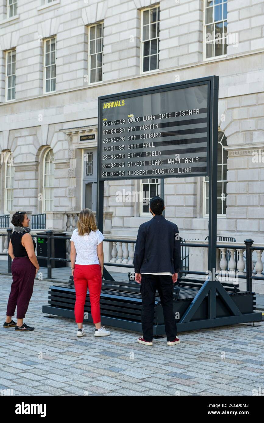 London, UK.  10 September 2020.  Staff members view Arrivals + Departures, a major interactive installation in the courtyard of Somerset House by Yara and Davina.  The artwork allows the public to memorialise their names on the mechanical flipboards which are often seen at a railway station or airport and is on show until 10 October 2020. Credit: Stephen Chung / Alamy Live News Stock Photo