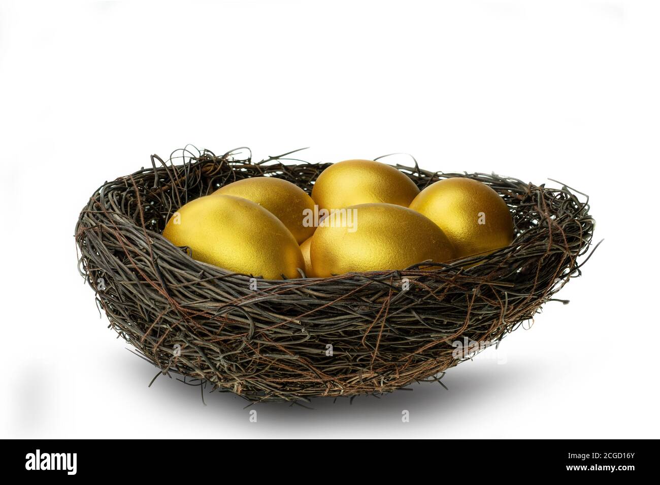 Golden eggs in decorative nest isolated at white background Stock Photo ...