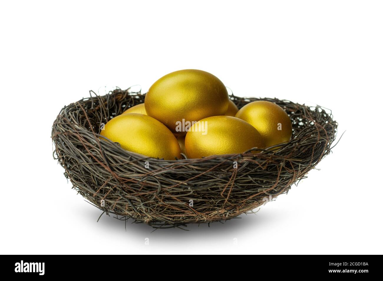 Golden eggs in decorative nest isolated at white background Stock Photo ...