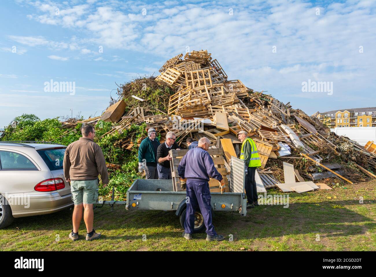 Building a large bonfire ready for Bonfire Night celebrations i(Guy Fawkes Night) on the South Coast n Littlehampton, West Sussex, England, UK. Stock Photo