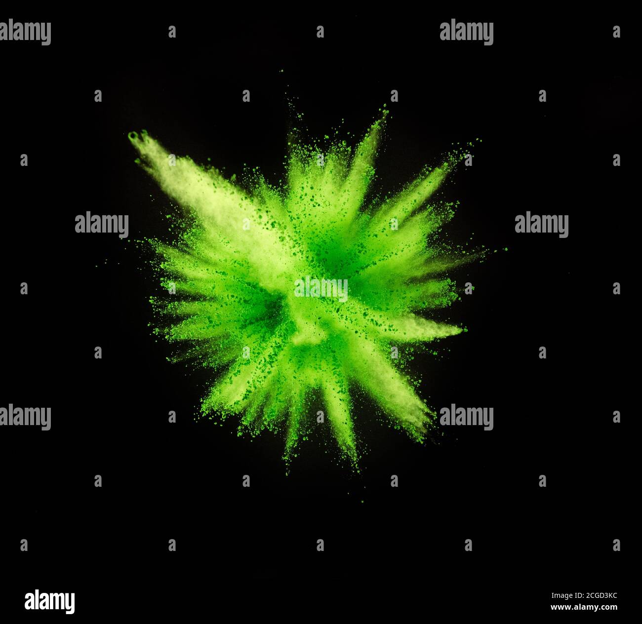 Explosion of green powder isolated on black background. Abstract ...