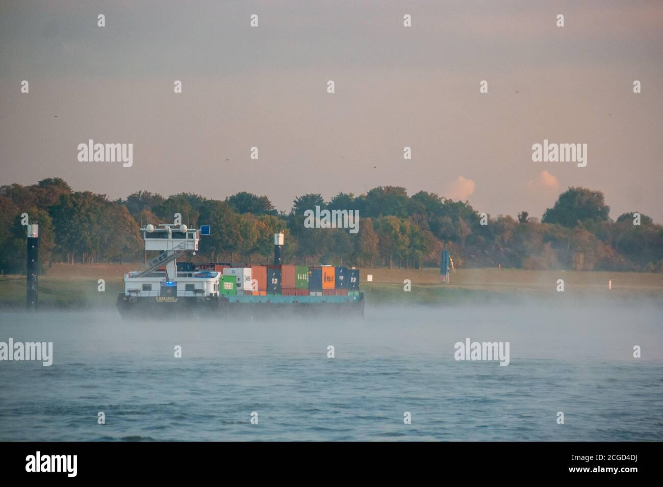 Cologne Germany August 2020, Inland shipping transport on the rhine river with containers, Large container and oiltanker vessel on the river rhein in Stock Photo
