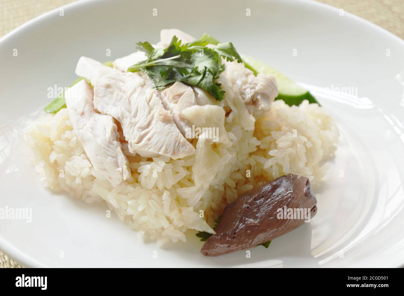 steamed rice topping boiled chicken on bamboo mat Stock Photo - Alamy